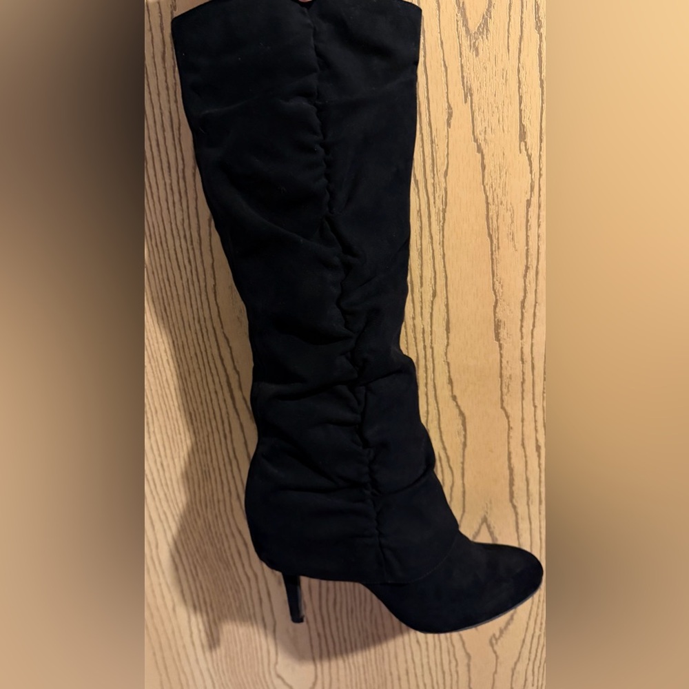 Black high heeled Fergie boots